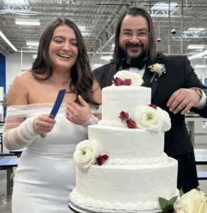 wedding couple cuts cake at Sam's Club